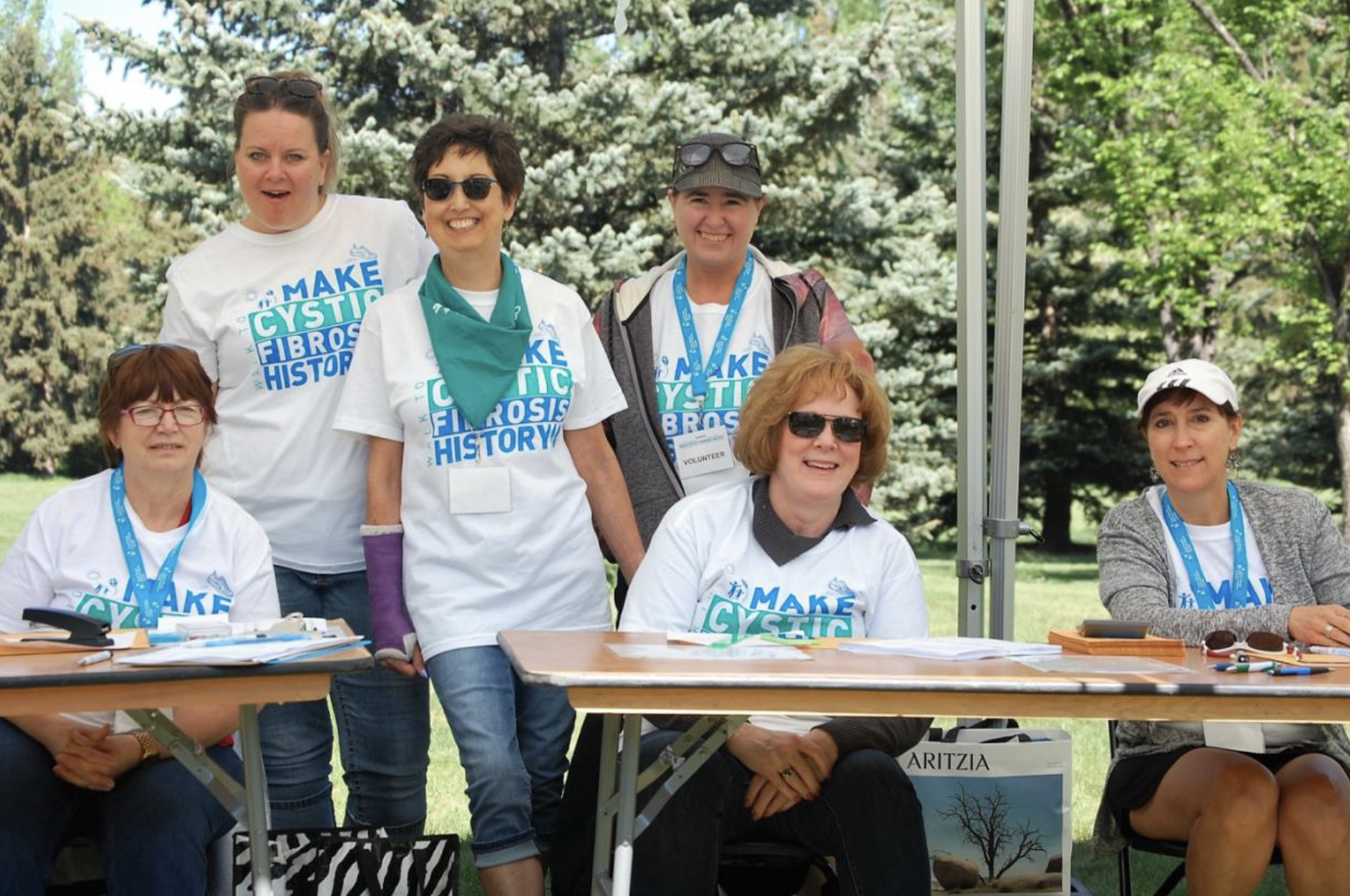 A group of volunteers at a walk to make cystic fibrosis history
